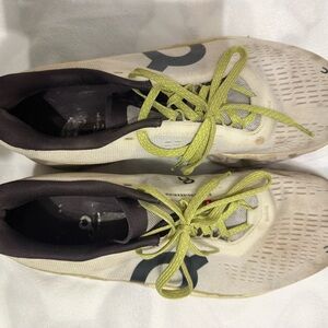 On Running Shoes with Green Accents
